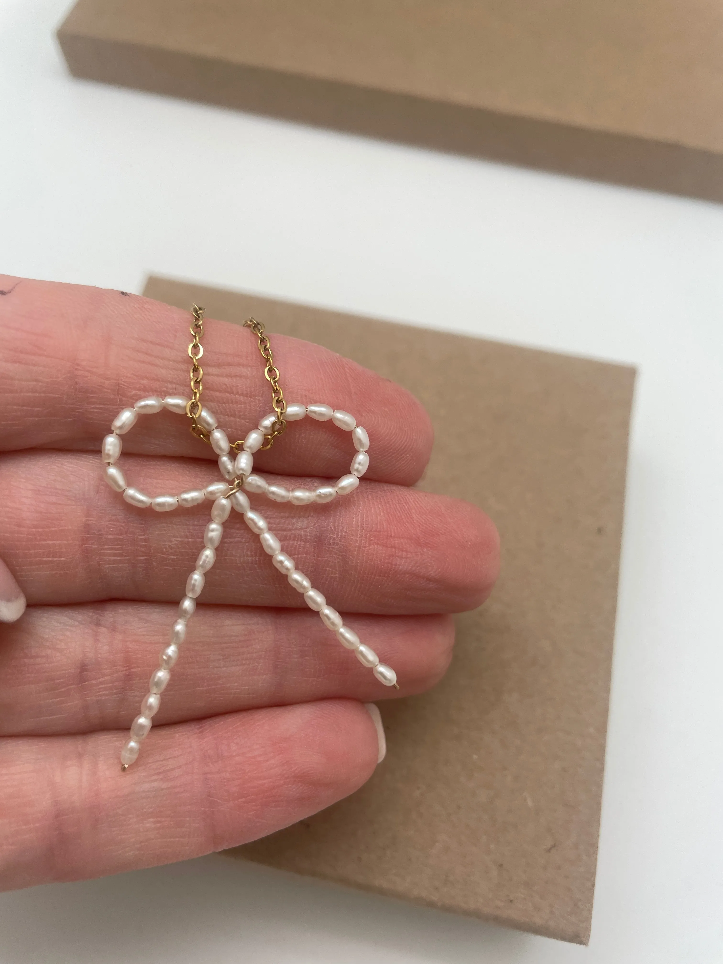 Freshwater pearl bow necklace