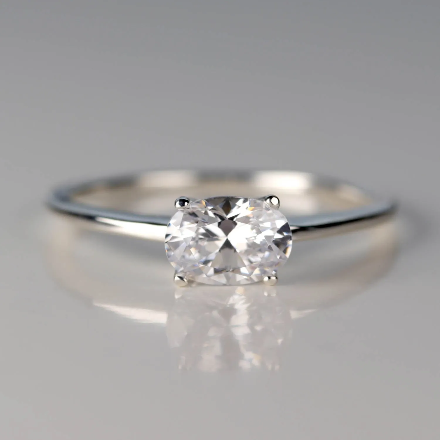 Oval Cut East-West Basket Solitaire Engagement Ring