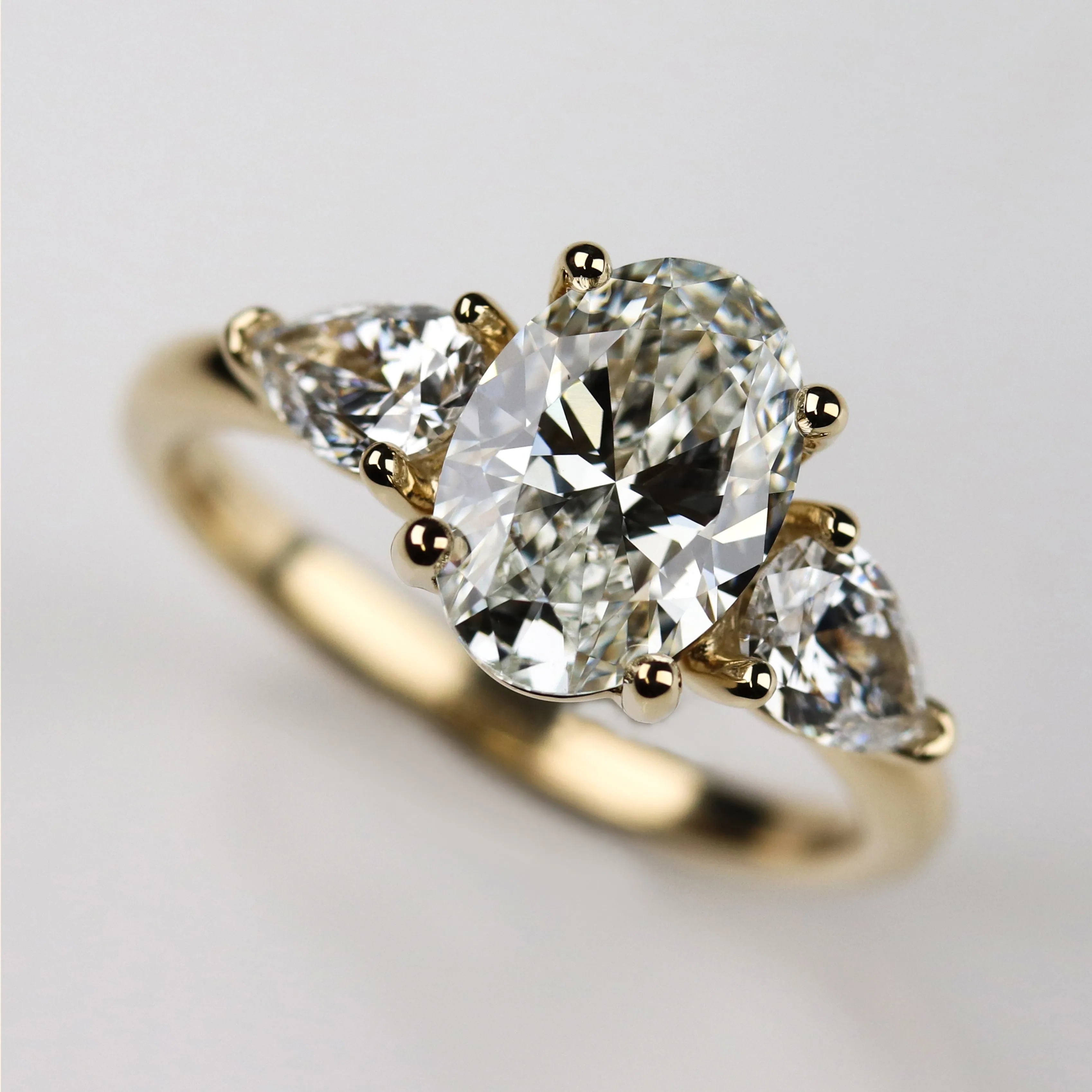 Oval Three Stone Basket Ring with a 9x7mm Lab-grown Diamond